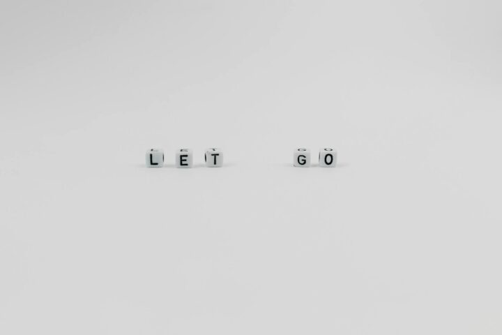 a let go slogan spelled with letter dice on white background