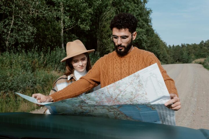 a couple looking at a map