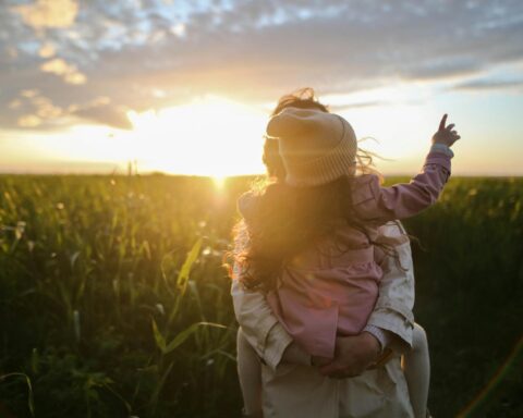 mother and daughter on grass