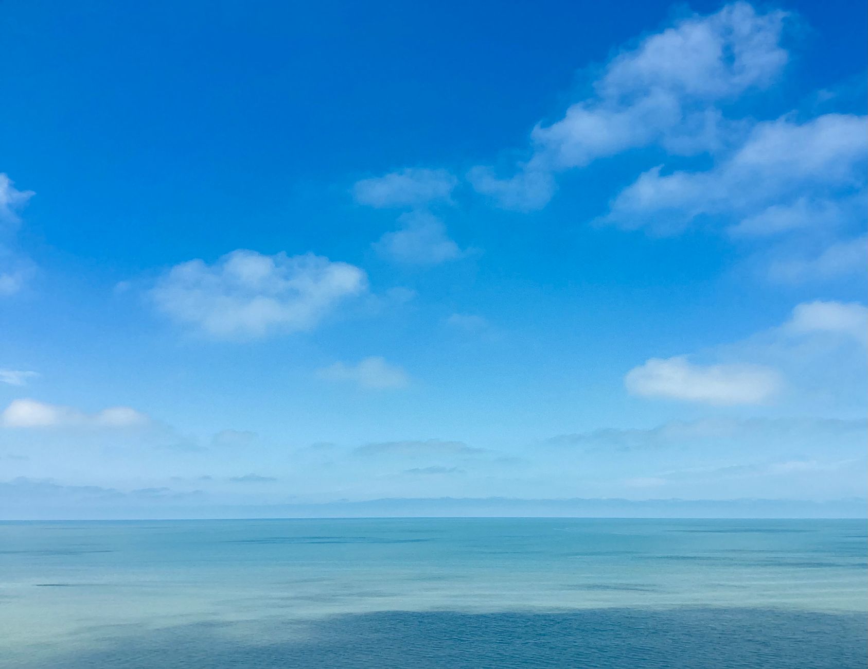 tranquil blue sky and ocean horizon view